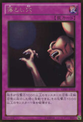 This is an image for the product Trap Hole that has a rarity of Gold Rare in the The Gold Box with a card code of GDB1-JP058 that is available on the TEKKX Product website.